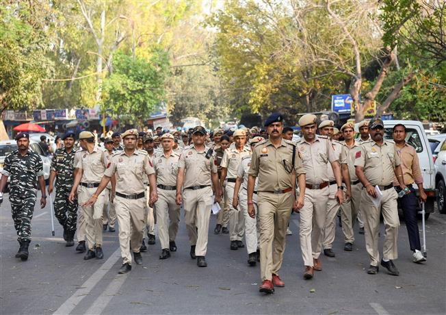 Security personnel monitor Shaheedi Park in central Delhi as the AAP calls for protests