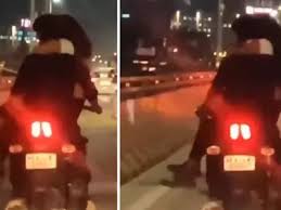 Man caught in Bengaluru while riding a bike with his girlfriend on his lap